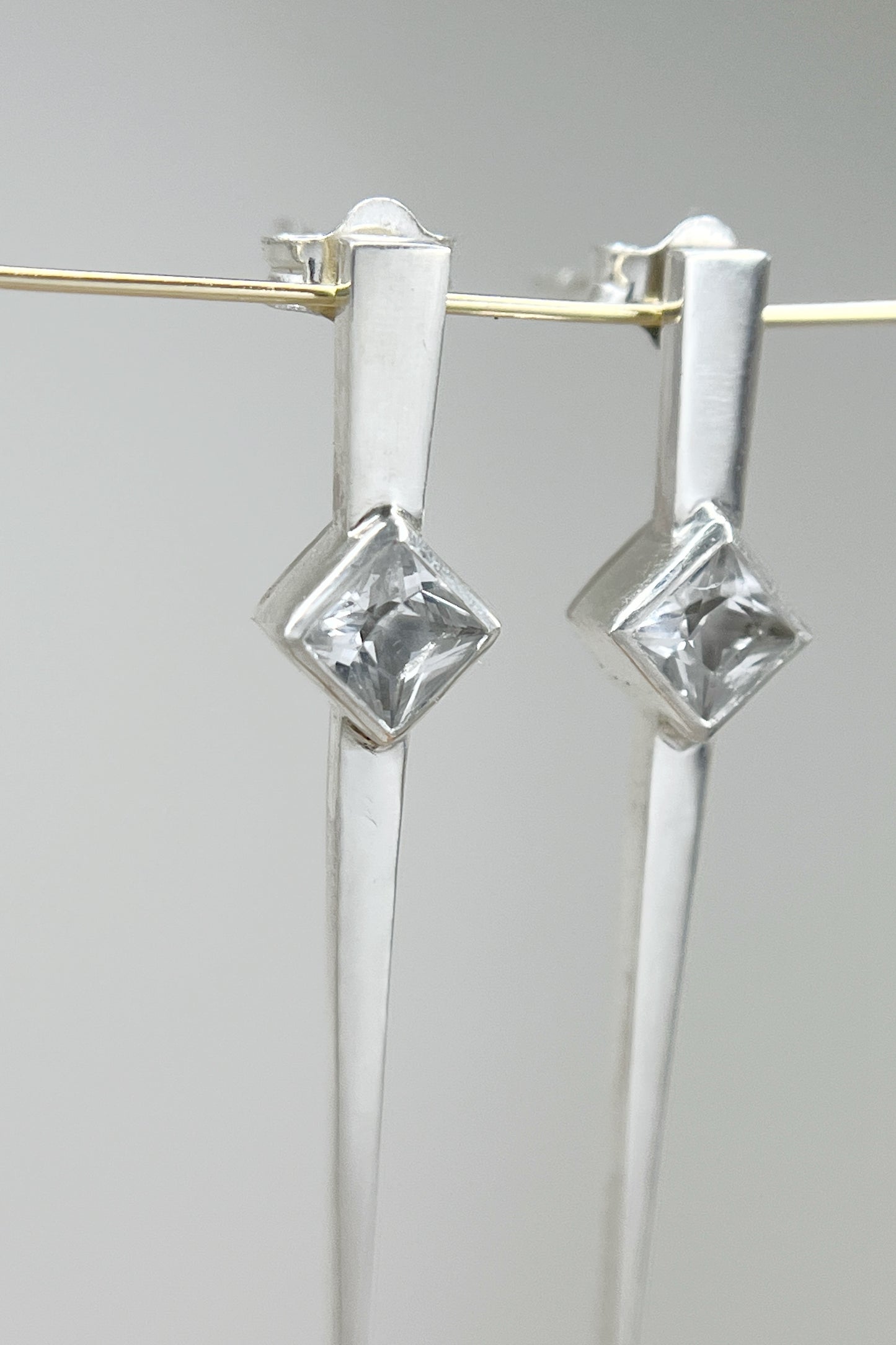 long spike earrings / white sapphire