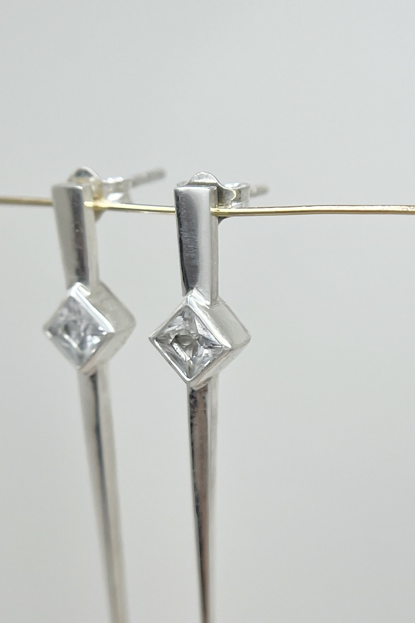 long spike earrings / white sapphire