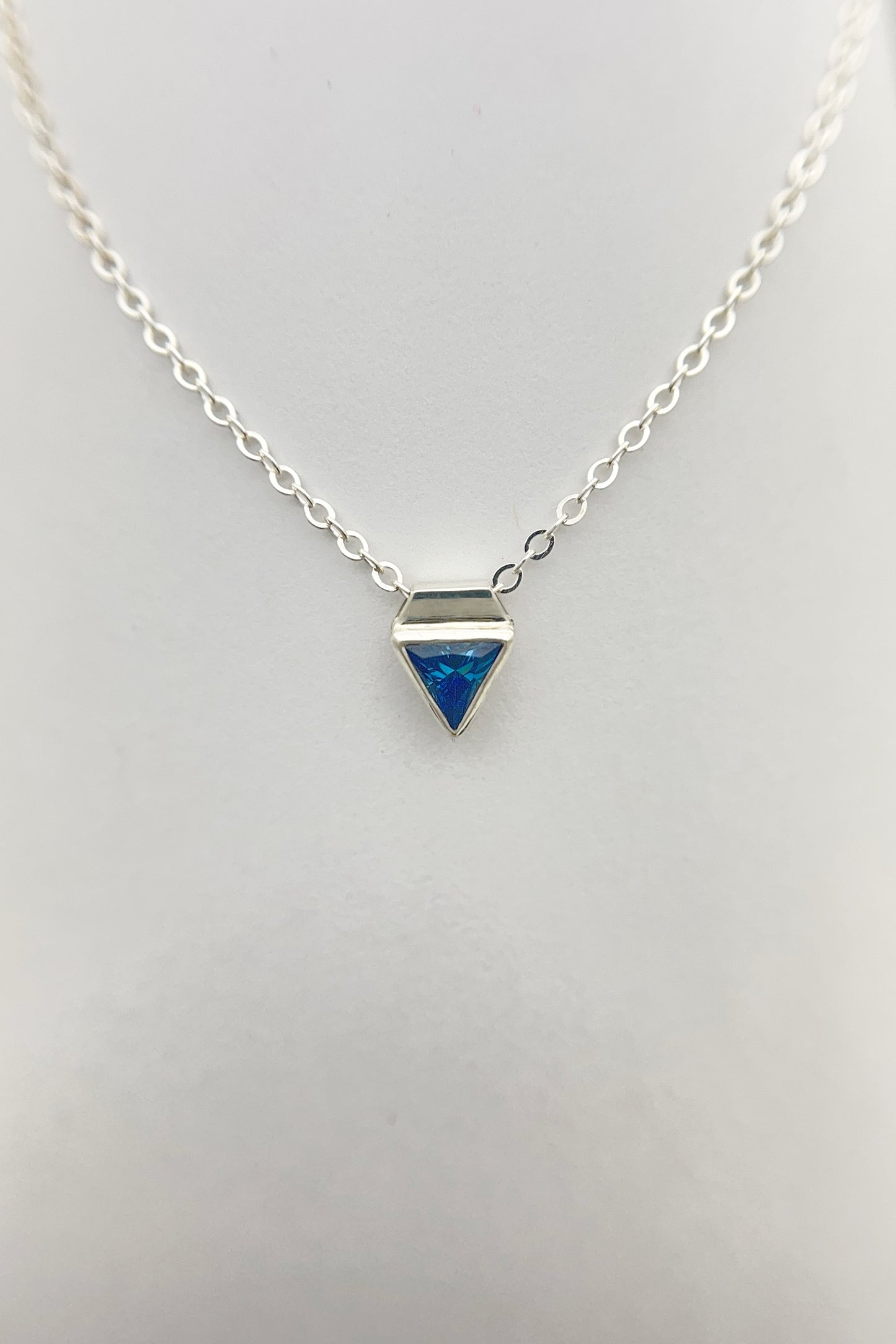 tiny triangle necklace / blue cubic zirconia