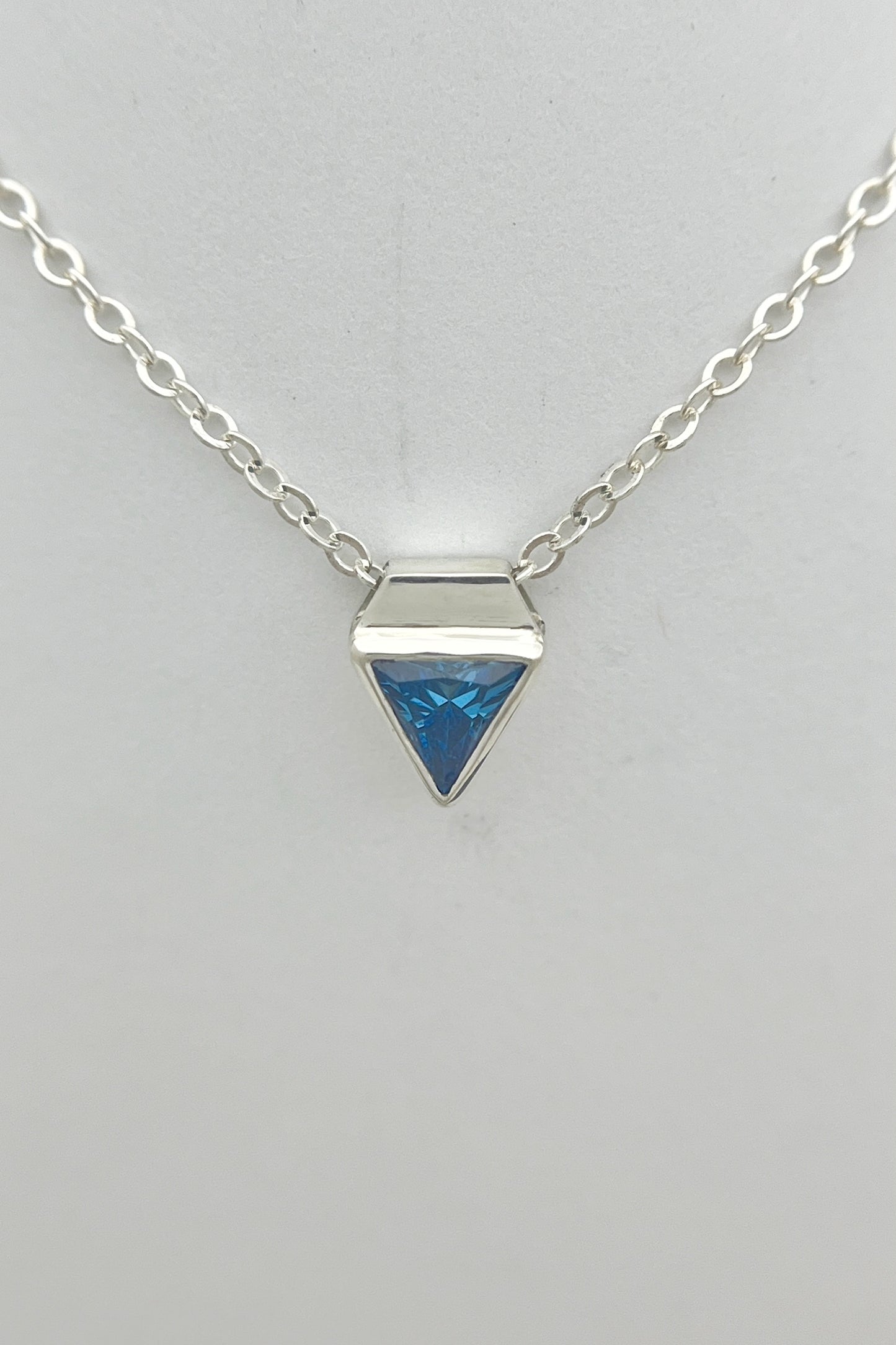 tiny triangle necklace / blue cubic zirconia