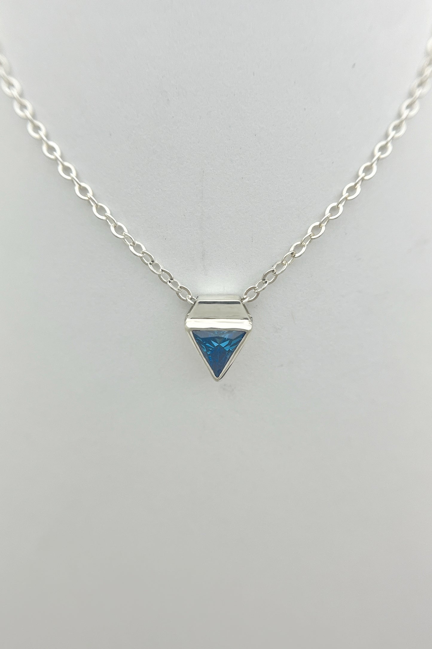 tiny triangle necklace / blue cubic zirconia