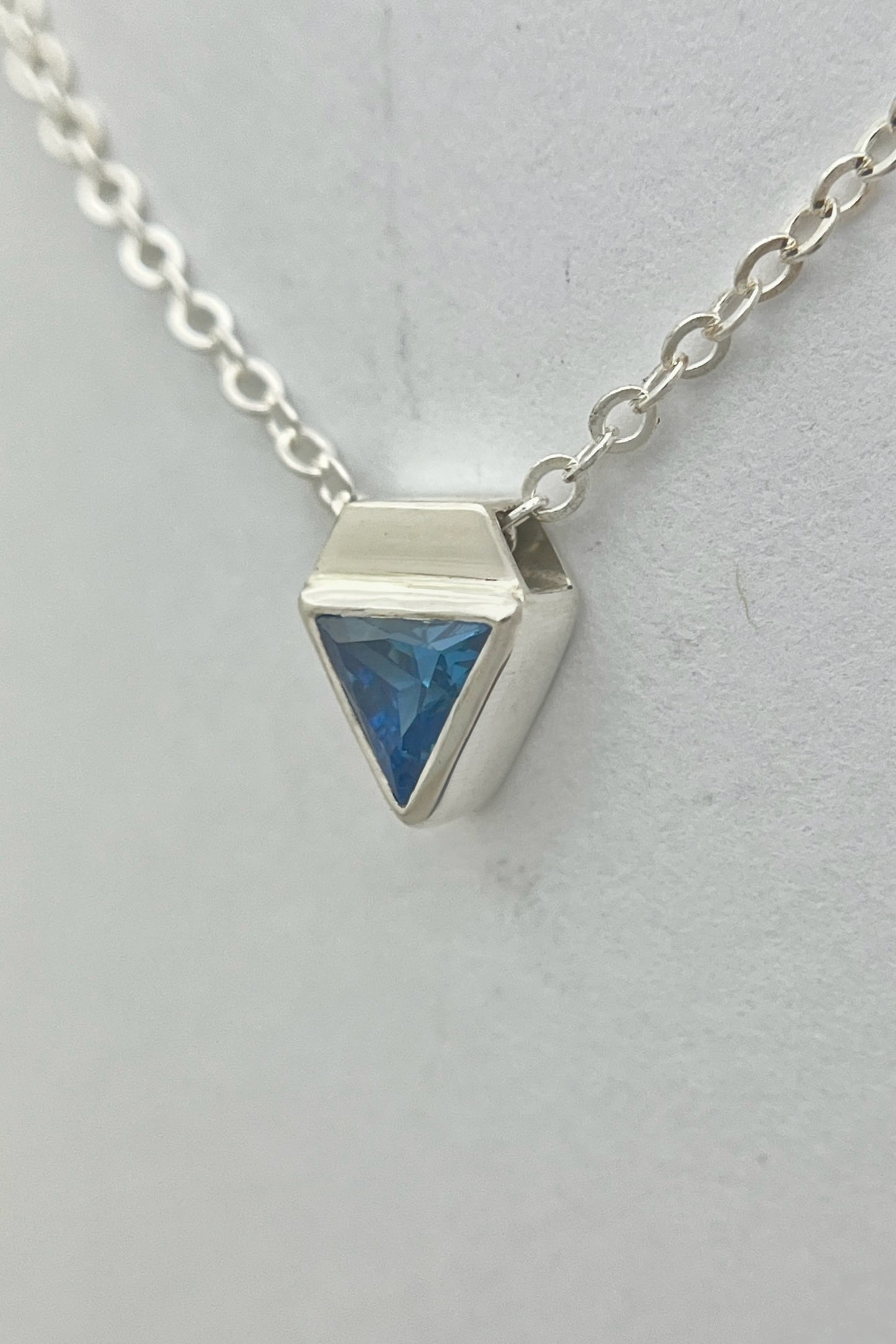 tiny triangle necklace / blue cubic zirconia