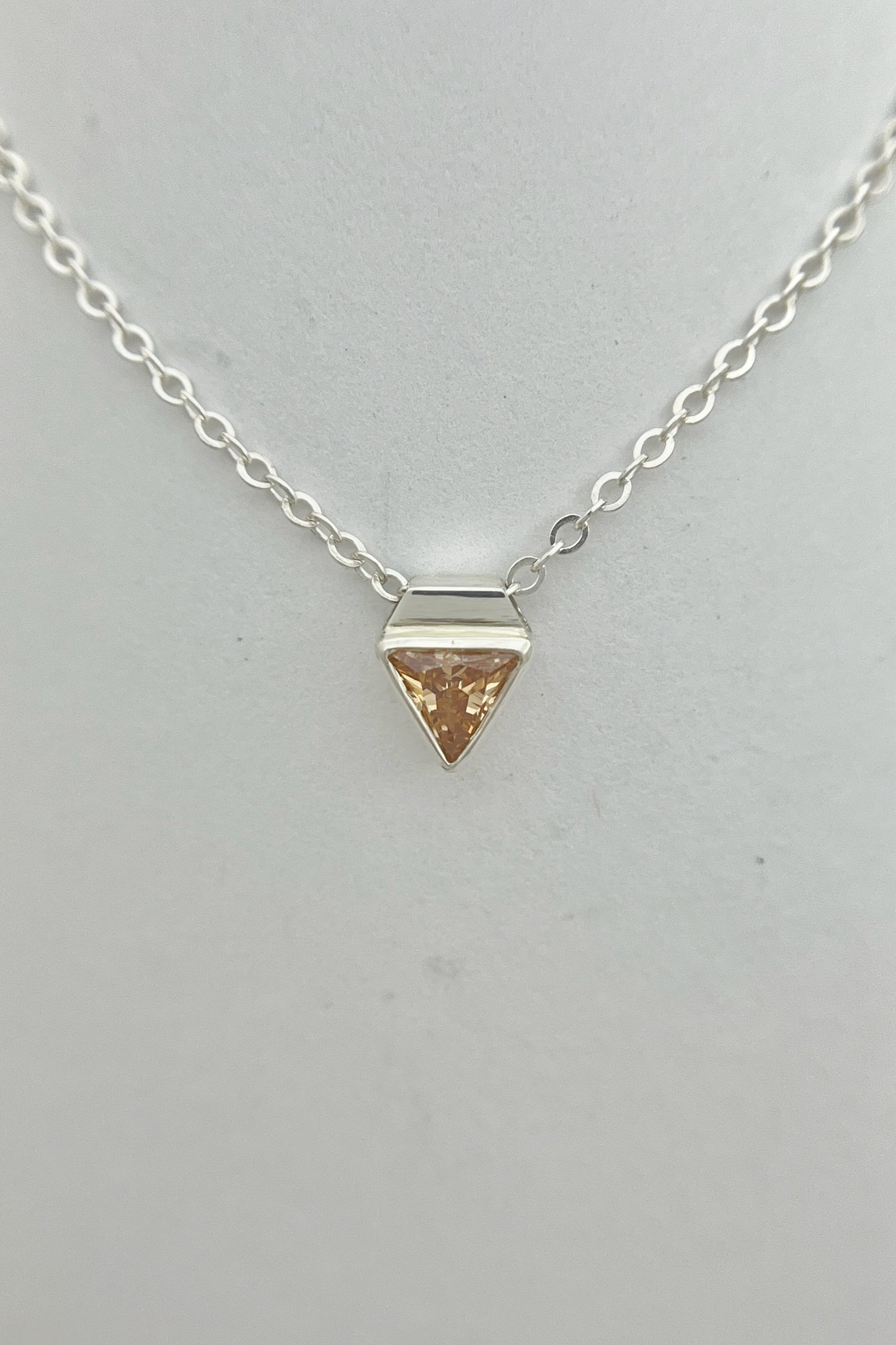 tiny triangle necklace / orange cubic zirconia