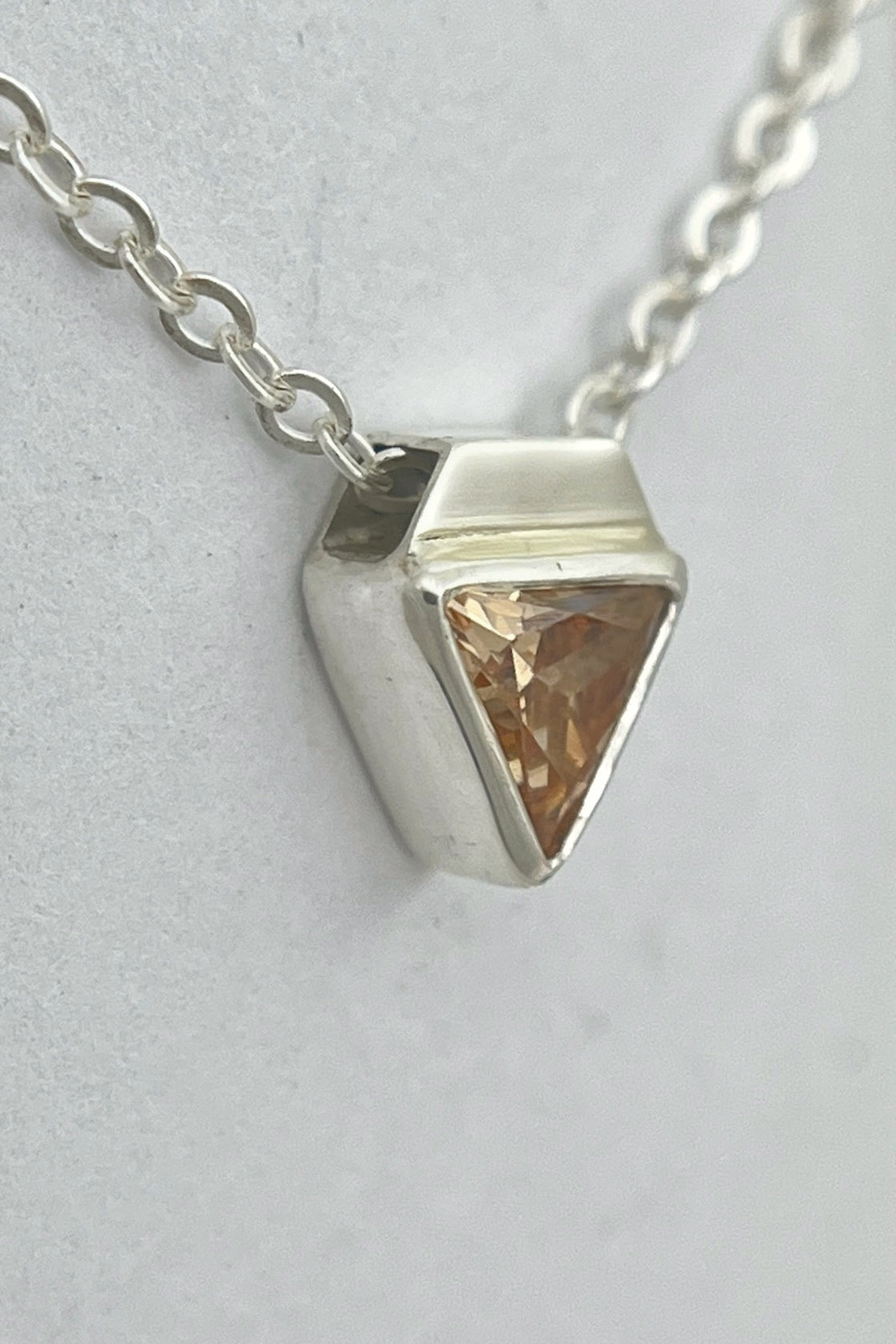 tiny triangle necklace / orange cubic zirconia