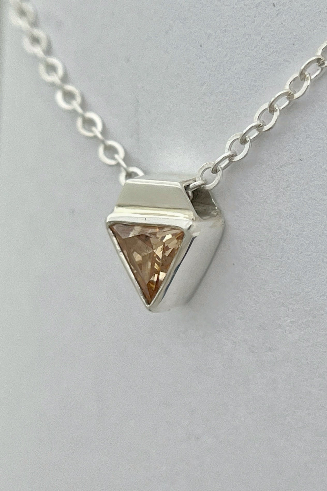 tiny triangle necklace / orange cubic zirconia