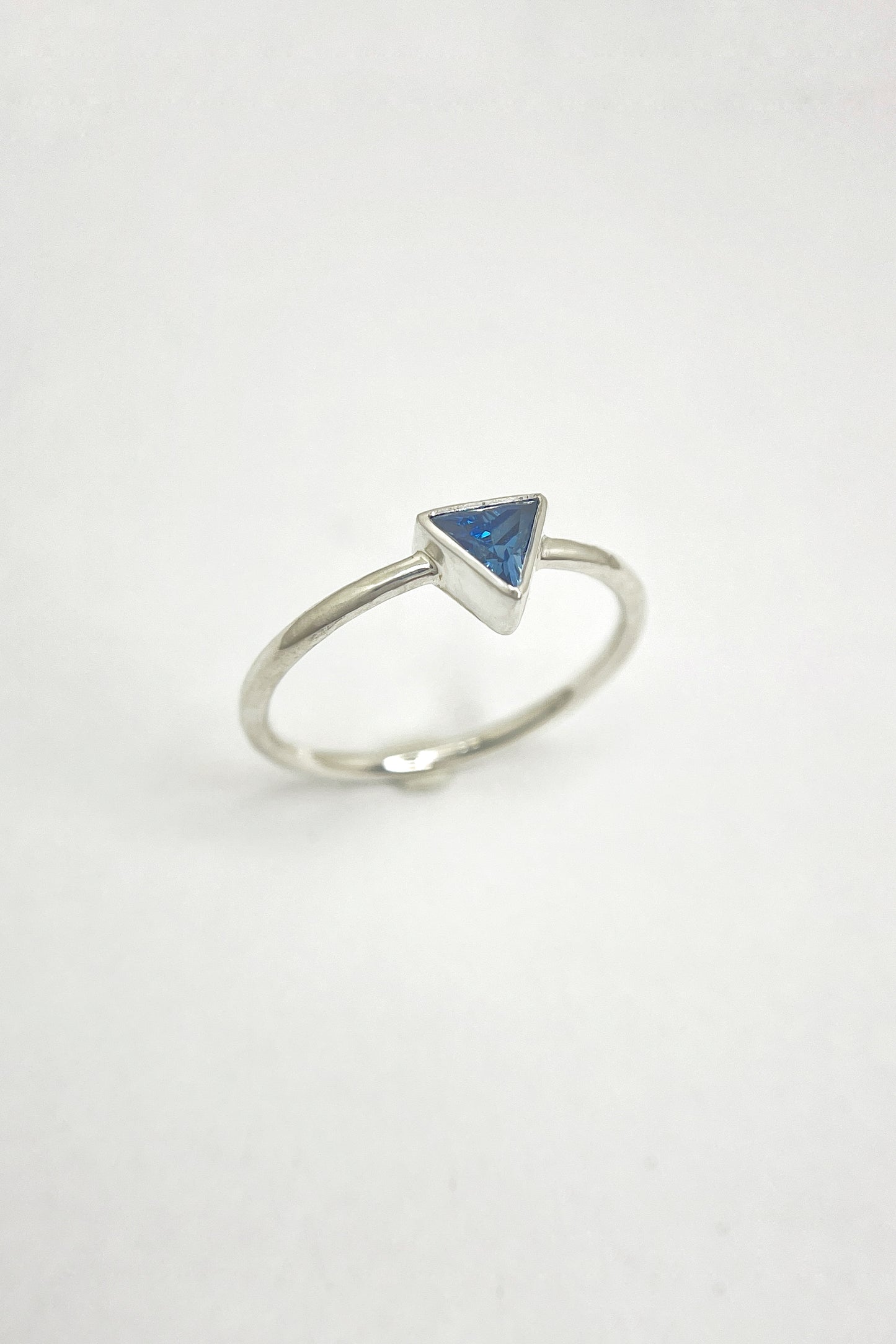 tiny triangle ring / blue cubic zirconia / size 8.5