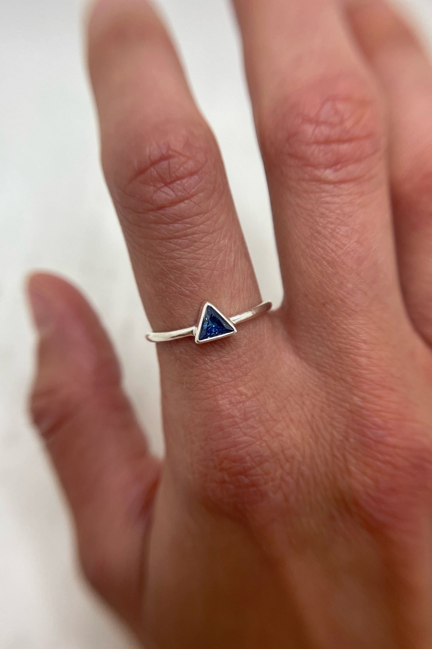 tiny triangle ring / blue cubic zirconia / size 8.5