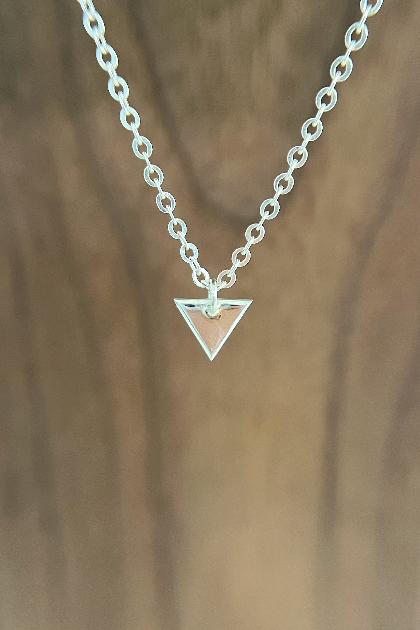 tiny silver triangle charm
