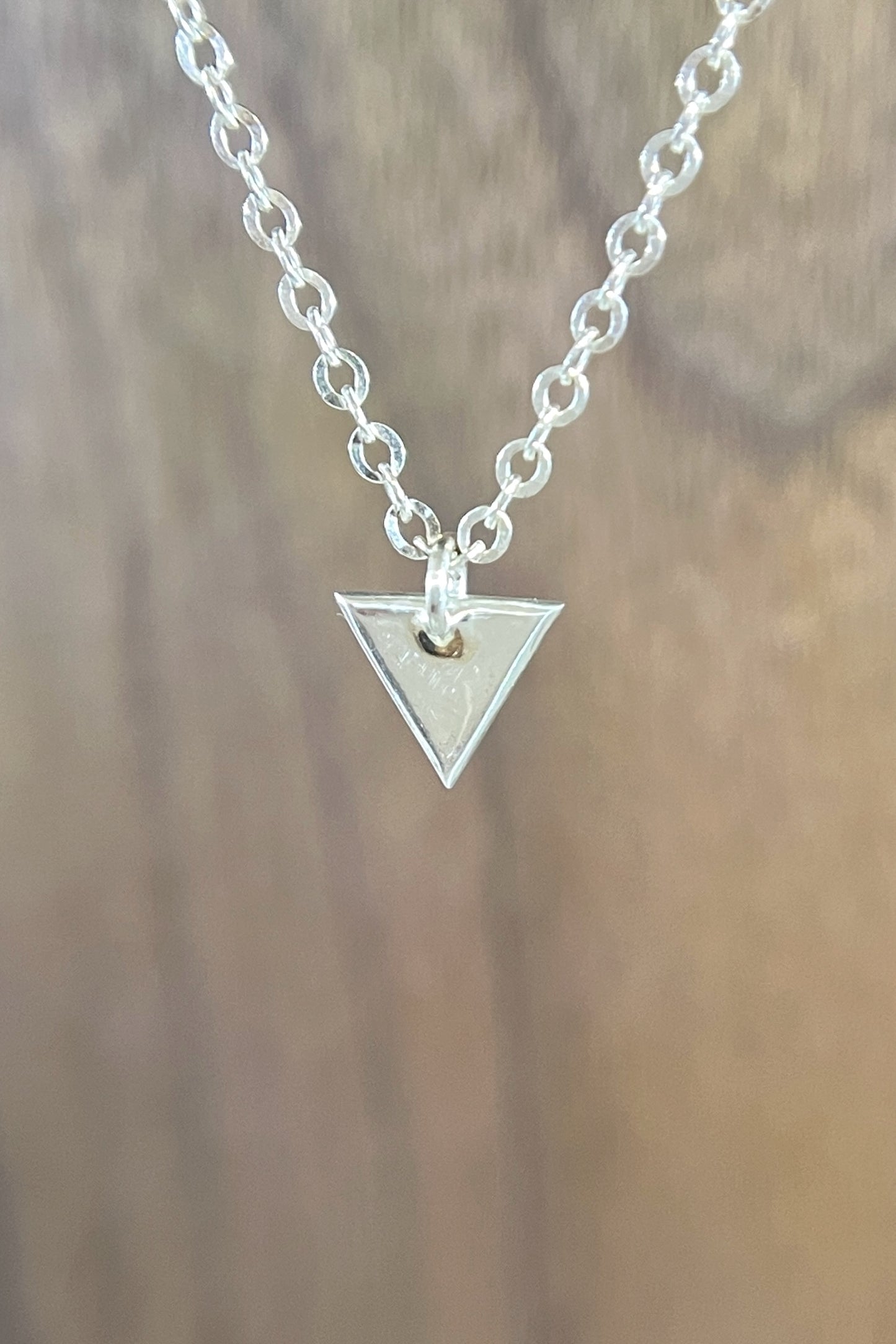 tiny silver triangle charm