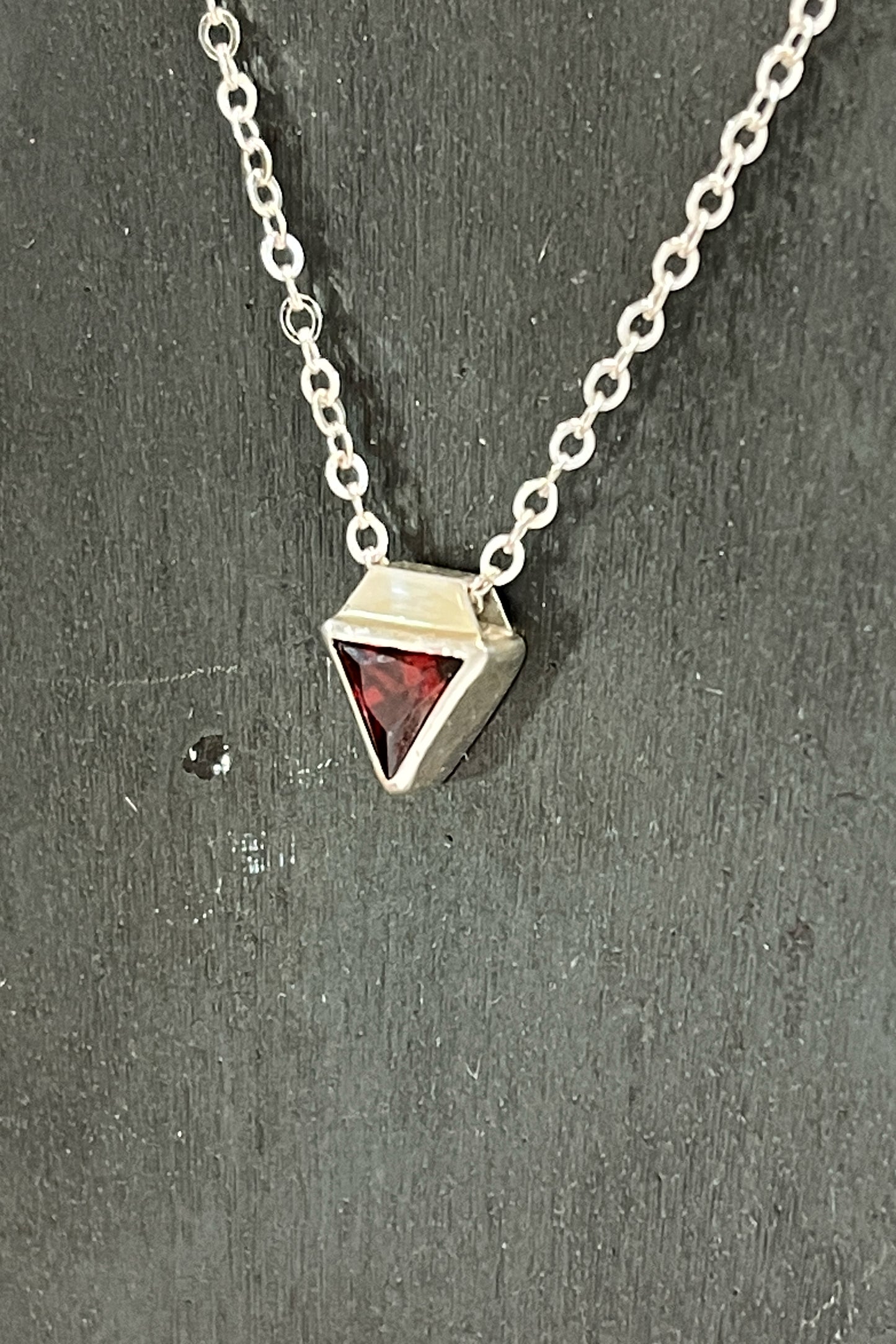 tiny triangle / red cubic zirconia