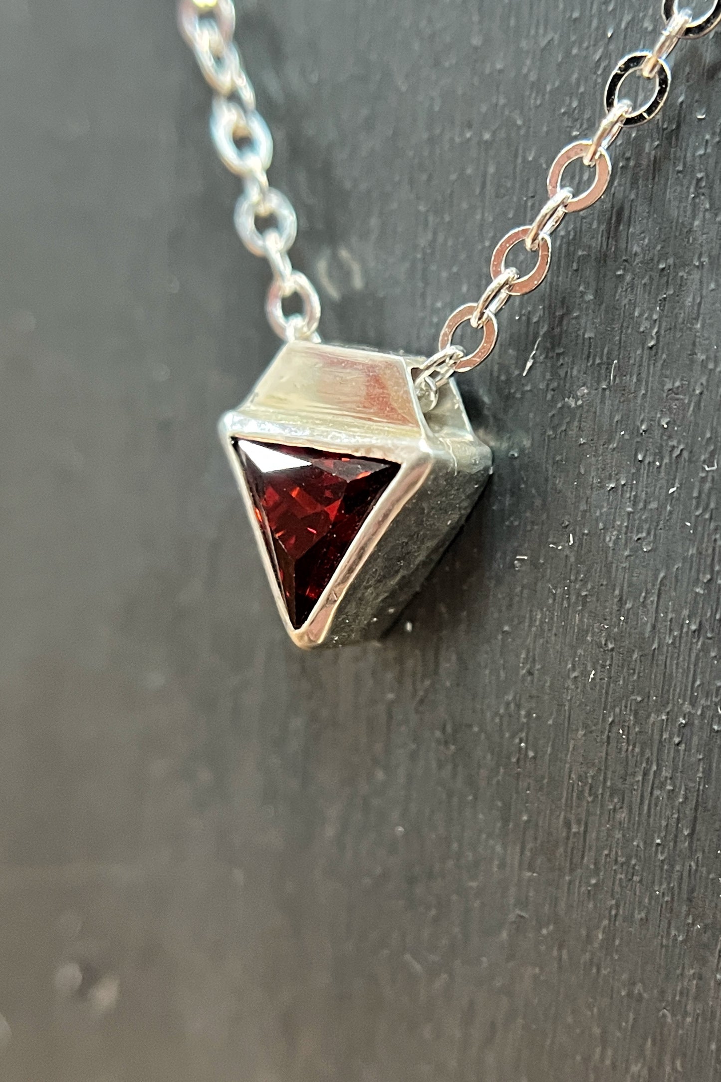 tiny triangle / red cubic zirconia