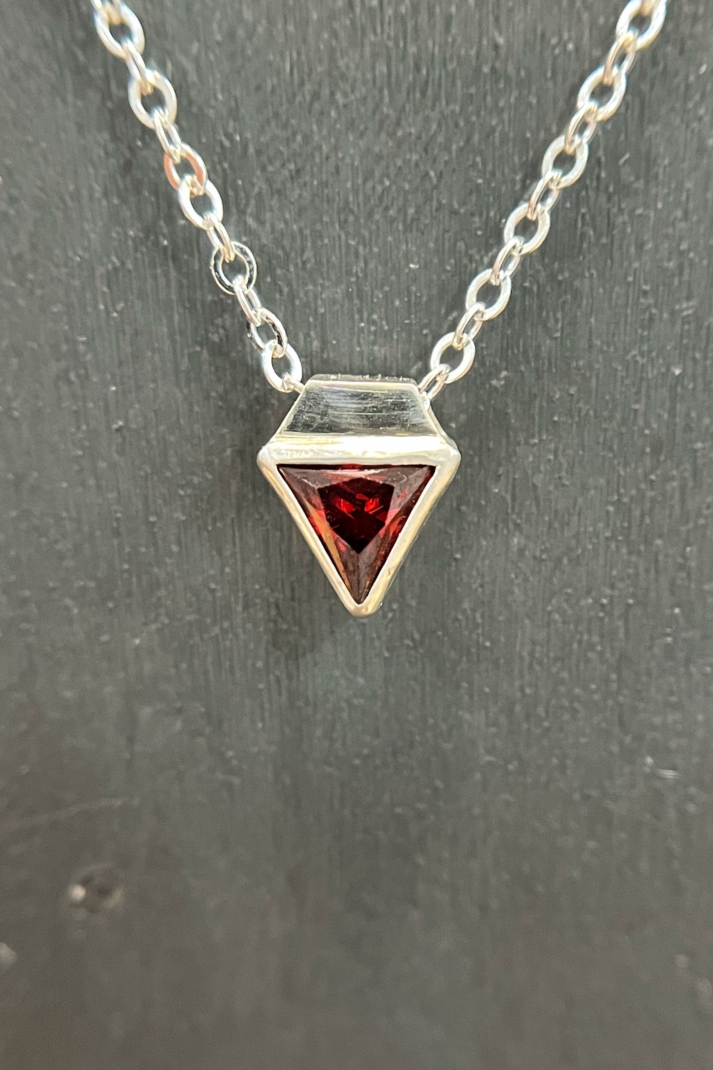 tiny triangle / red cubic zirconia