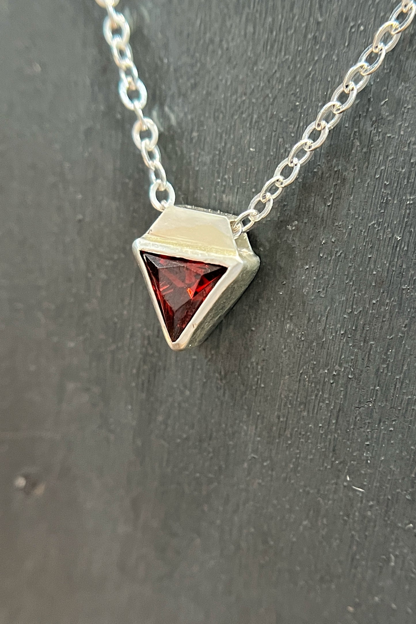 tiny triangle / red cubic zirconia