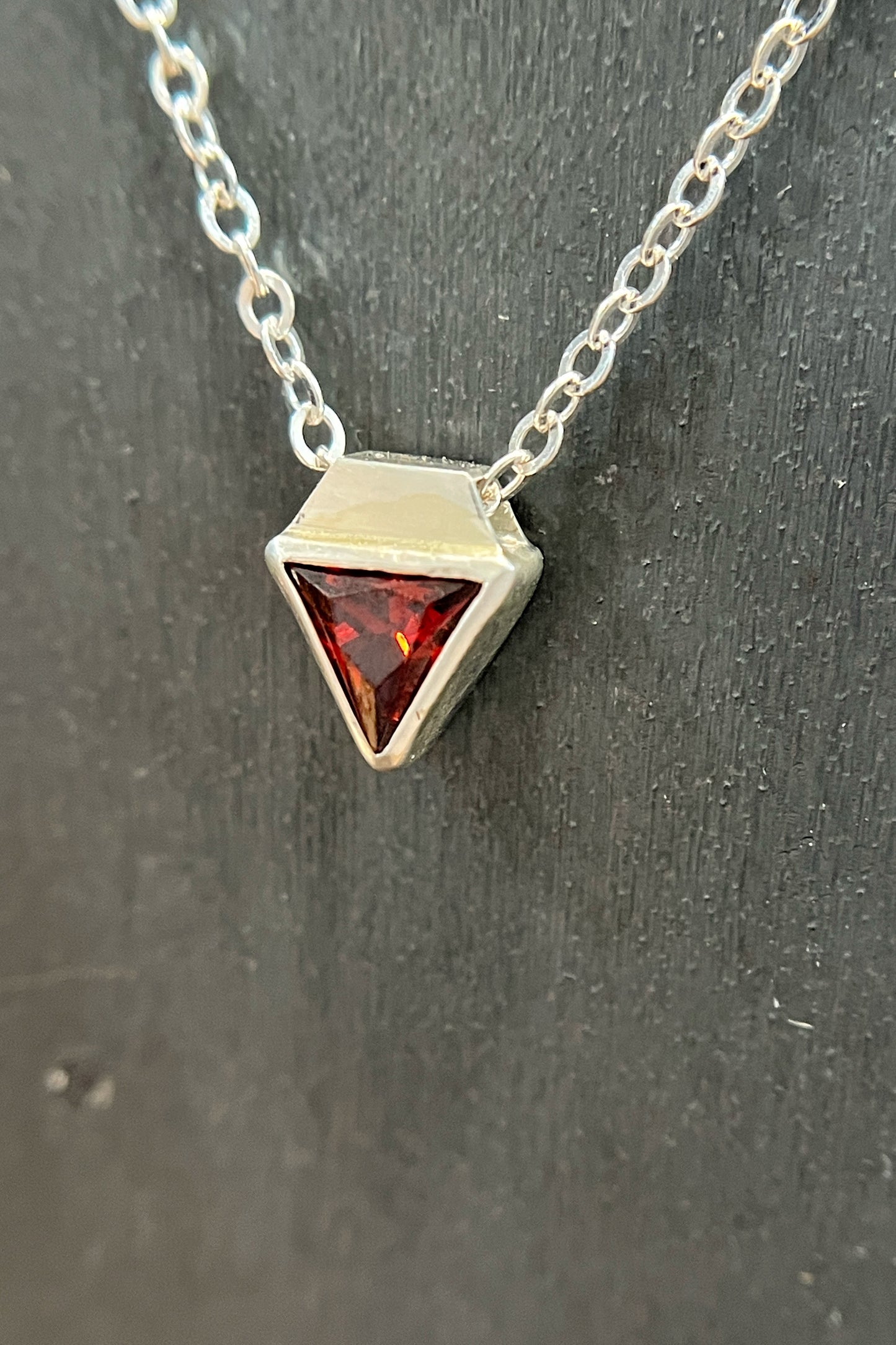 tiny triangle / red cubic zirconia