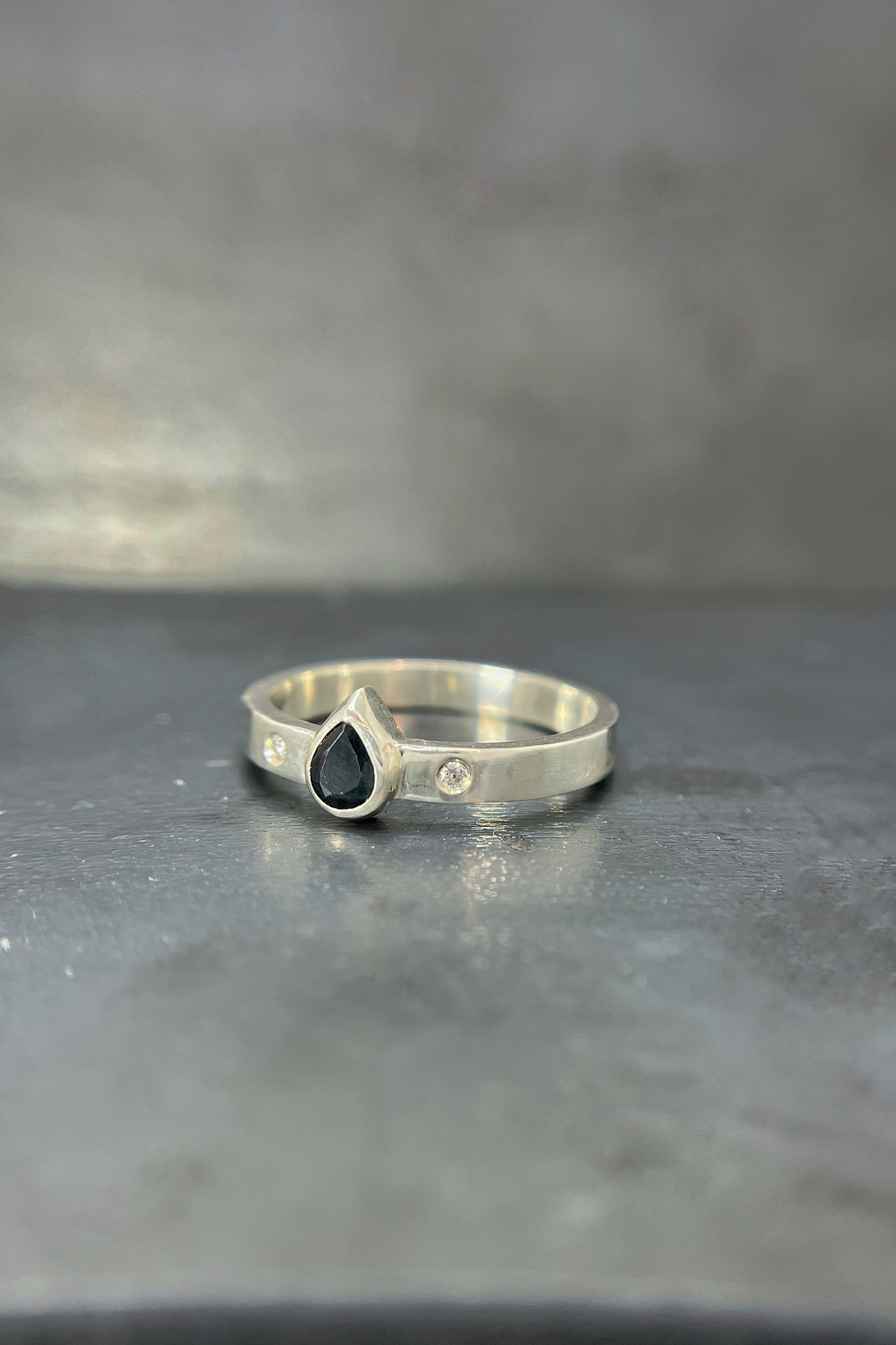 deep blue sapphire pear ring with flush sets / size 9