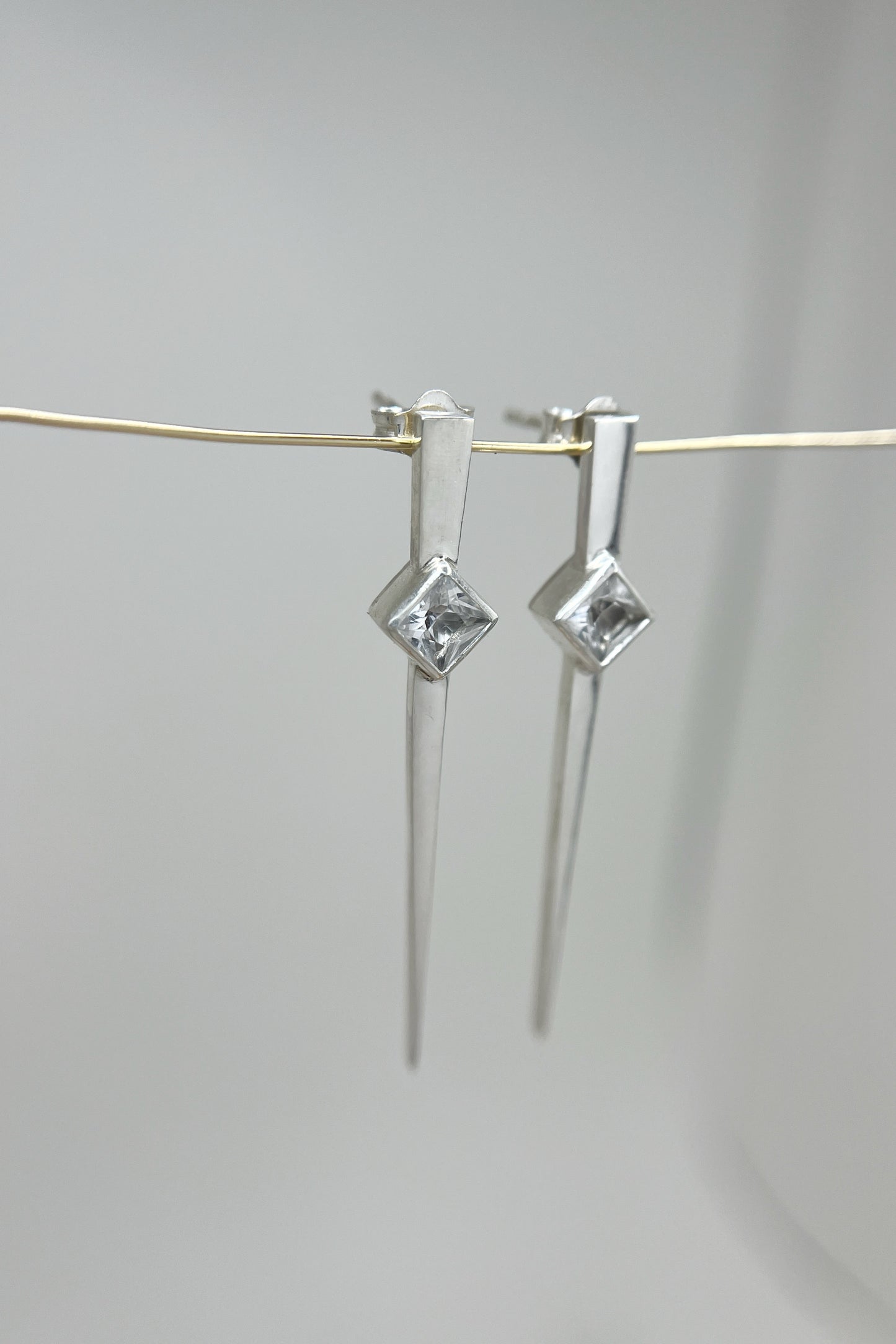 long spike earrings / white sapphire