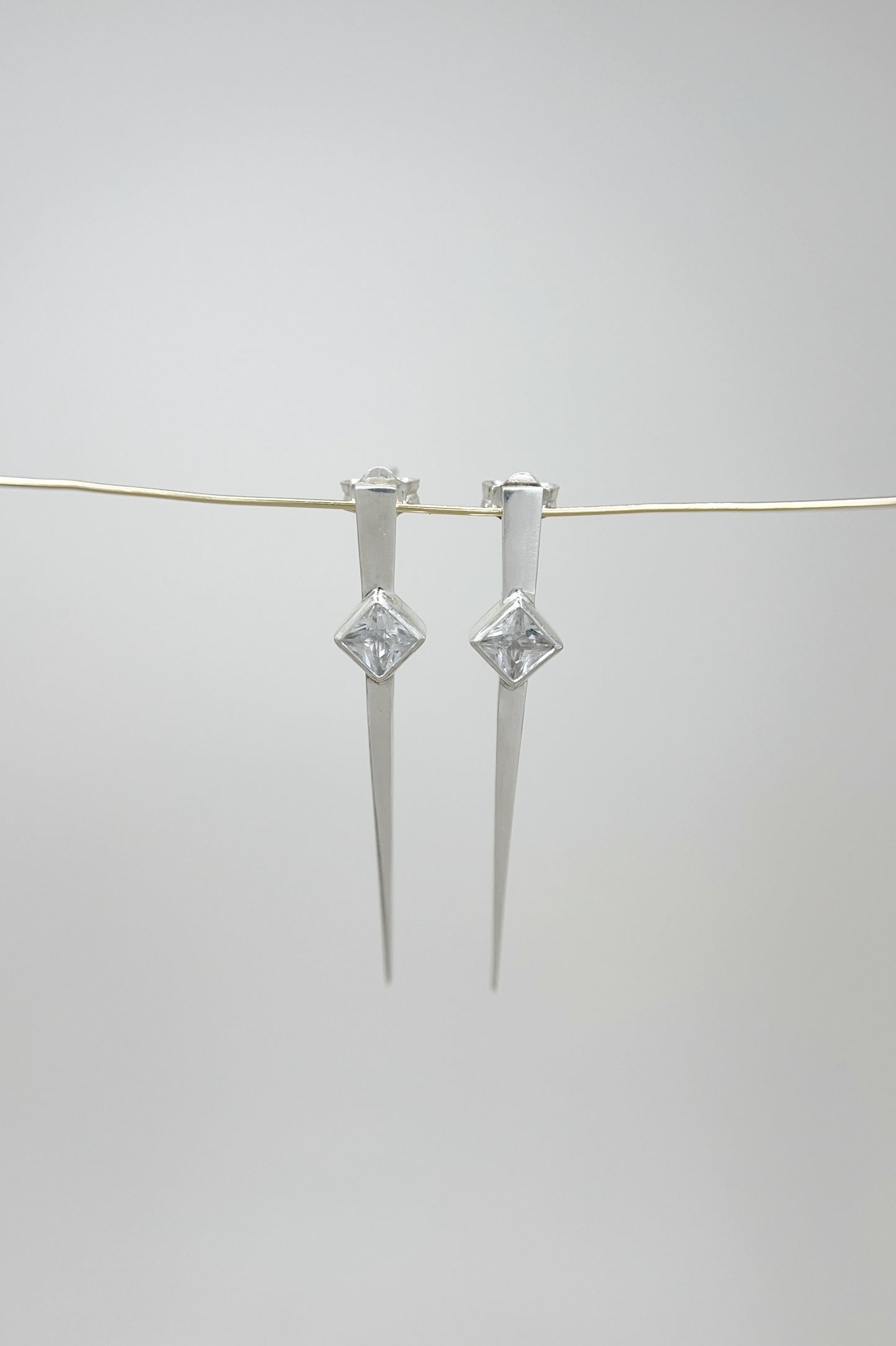 long spike earrings / white sapphire