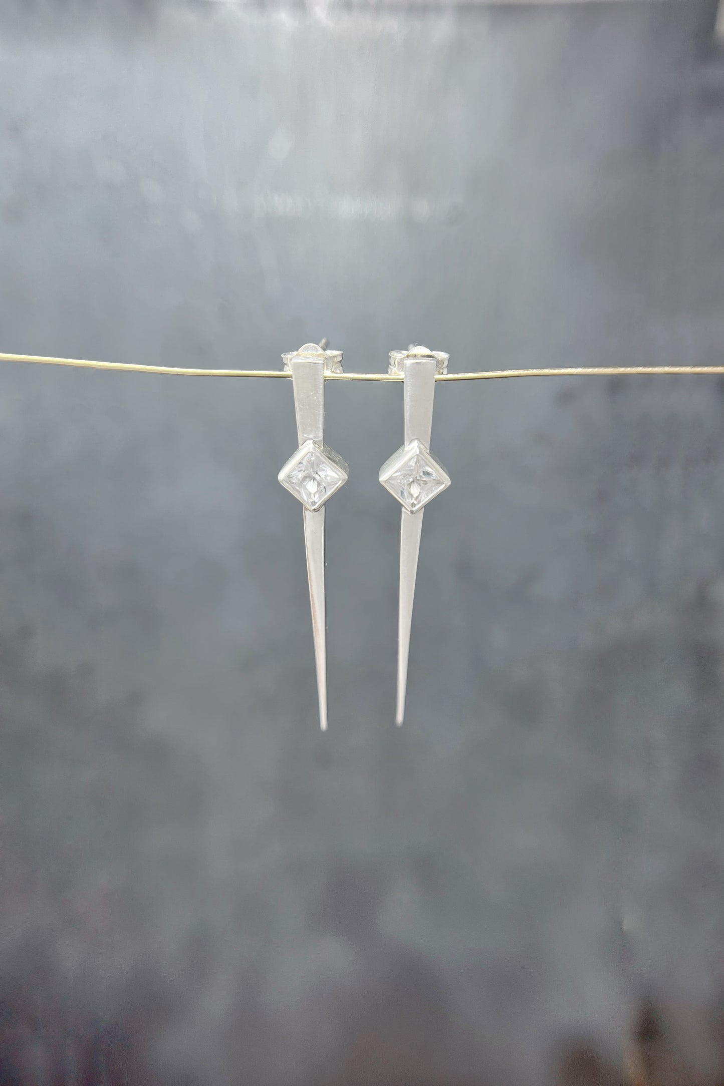long spike earrings / white sapphire