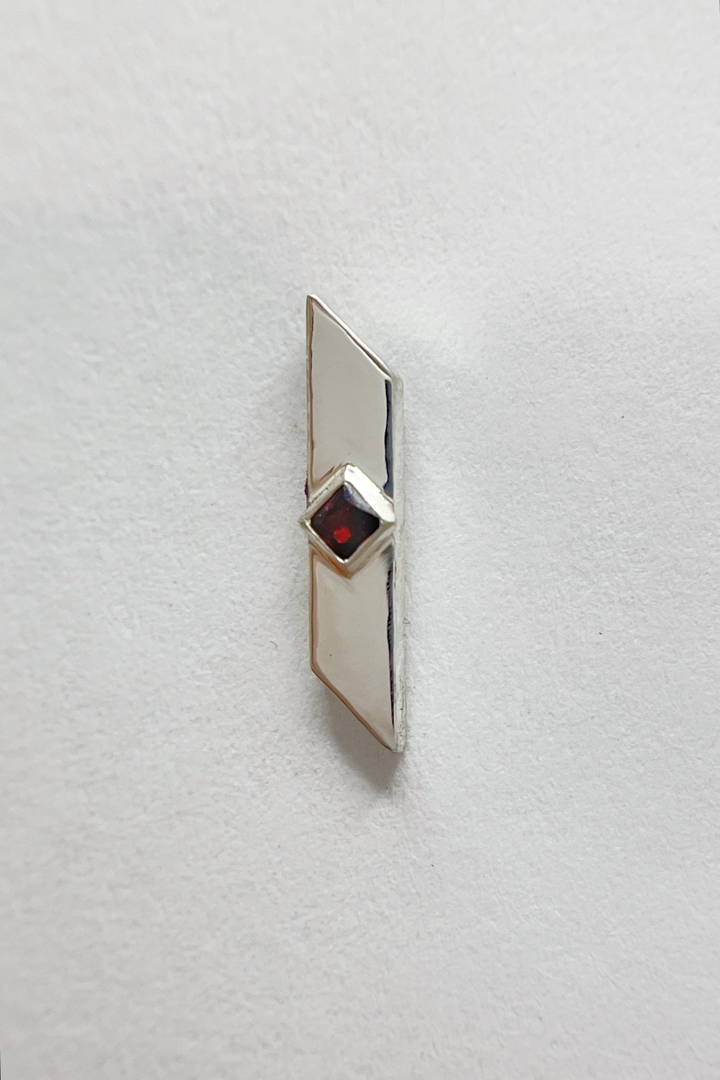 warp stud earrings / garnet