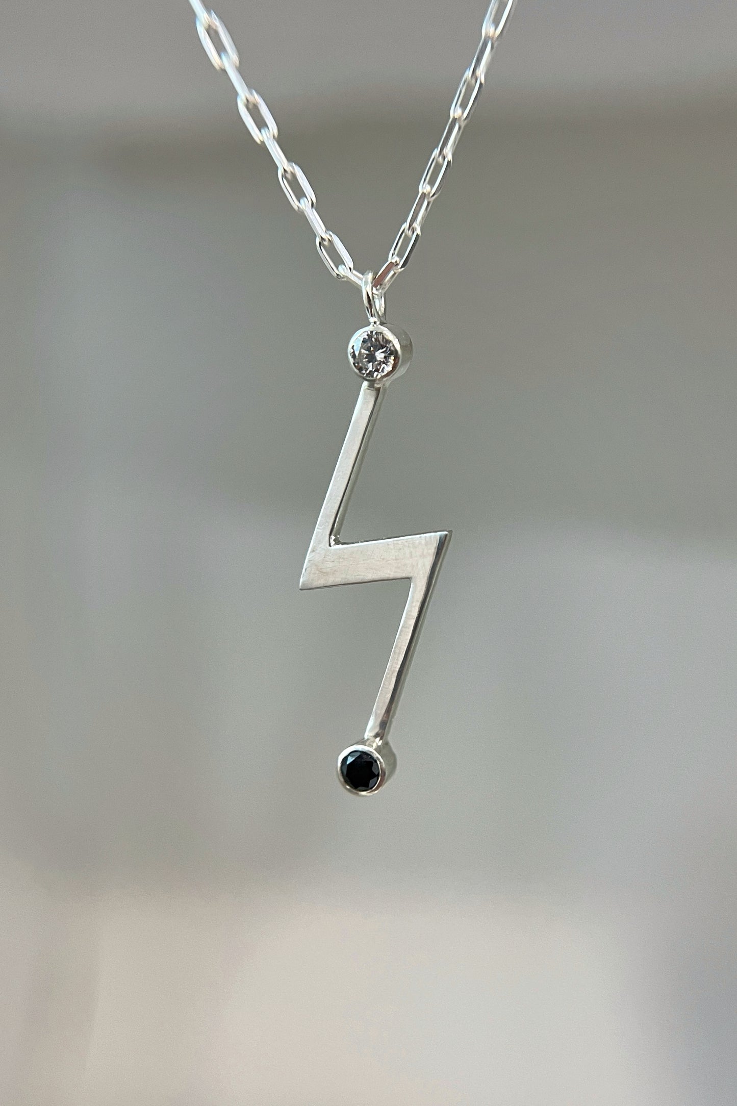 lightning bolt necklace / white cz & black spinel
