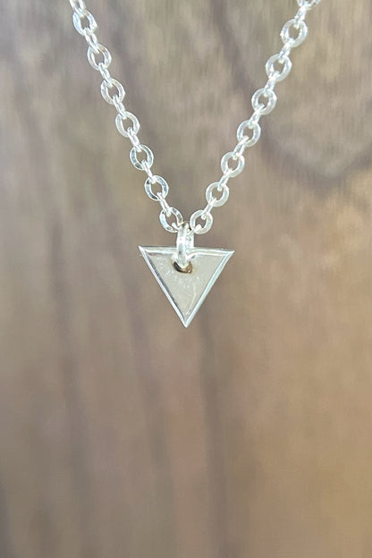 tiny silver triangle charm