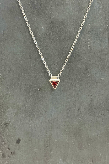 tiny triangle / red cubic zirconia