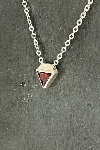 tiny triangle / red cubic zirconia