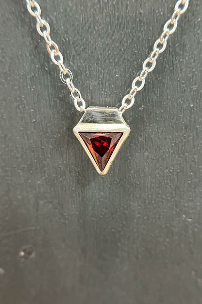 tiny triangle / red cubic zirconia